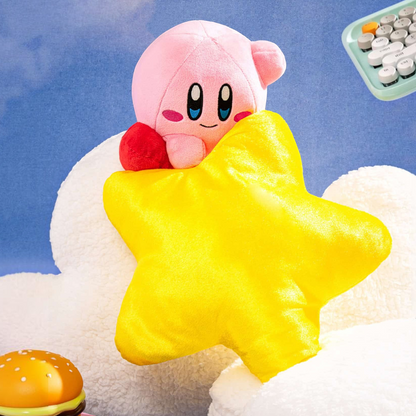 Otaku Boxes 10.5-inch Kirby plush holding a shiny yellow Warp Star with red feet on a fluffy white cloud background